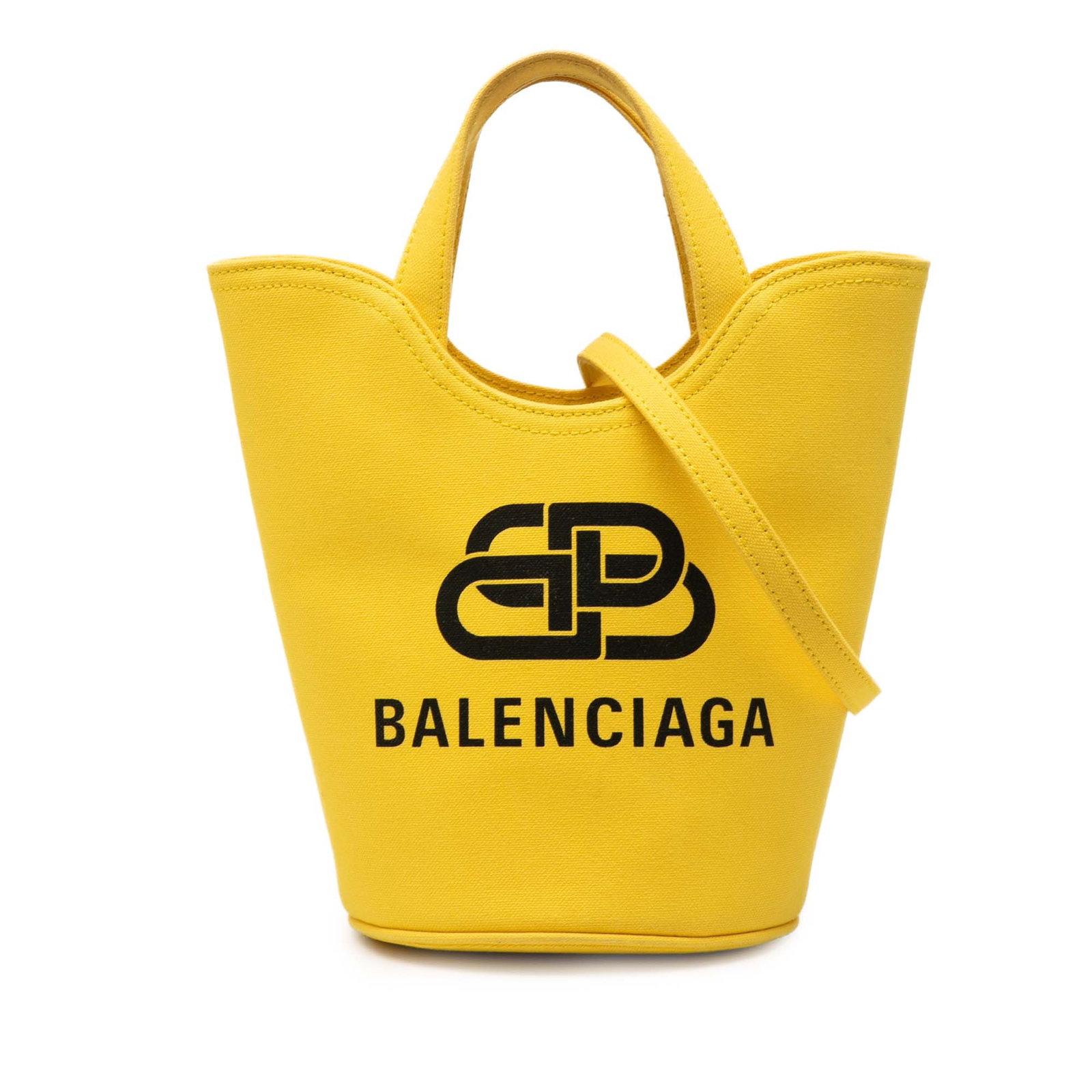 Balenciaga Wave XS Bucket Bag in Yellow Canvas: Balenciaga Wave XS Bucket Bag in Yellow Canvas Balenciaga Canvas Wave Bucket Bag XS in yellow fabric, made in Italy. This bucket bag features a canvas body, flat handles, a detachable and adjustable f