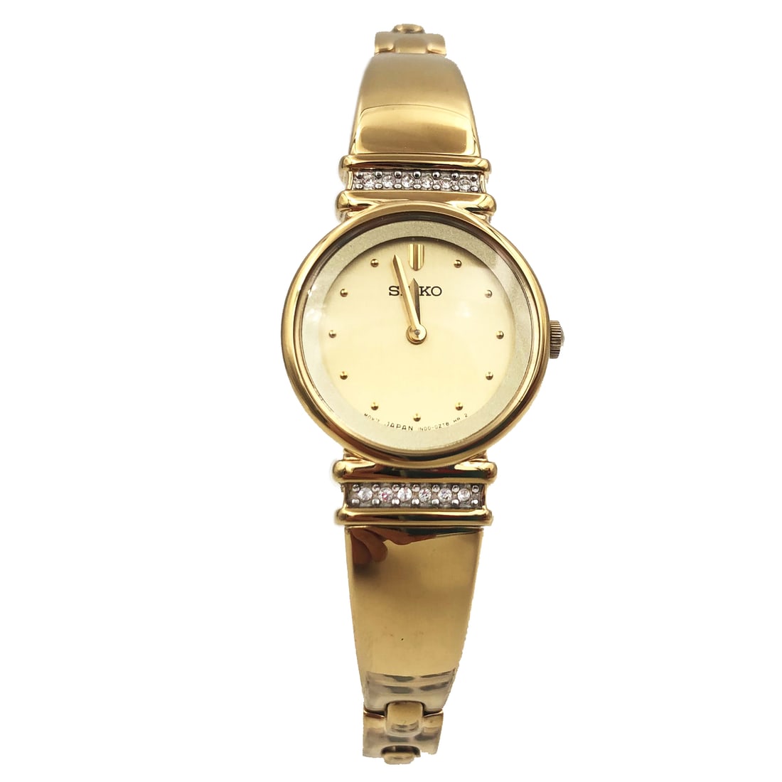 Seiko Ladies Quartz Dress Watch Gold Tone Champagne Dial SUJG34 with Box and Papers: Seiko Ladies Quartz Dress Watch Gold Tone Champagne Dial SUJG34 with Box and Papers This elegant Seiko Dress watch showcases a stunning champagne dots dial, perfectly complemented by a gold-tone stain