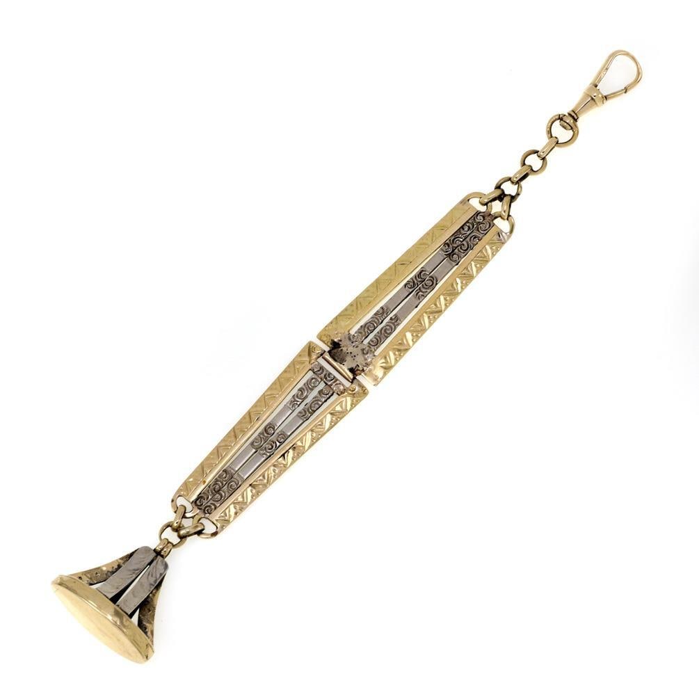 Art Deco 14k Two Tone Gold Vintage Watch Fob 5.5 Inches: Art Deco 14k Two Tone Gold Vintage Watch Fob 5.5 Inches This exquisite vintage watch fob is a stunning example of Art Deco design, crafted from 14k yellow and white gold. The fob features two hinged p