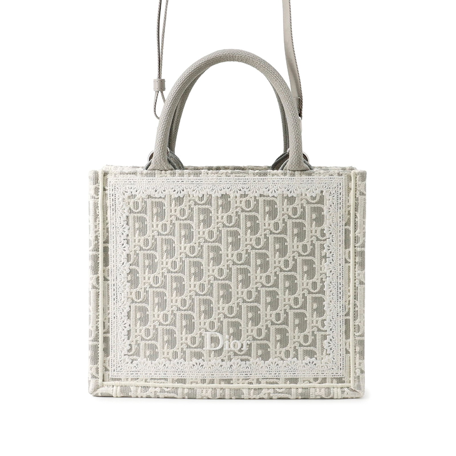Dior Mini Book Tote in Oblique Embroidered Canvas with Lace: Dior Mini Book Tote in Oblique Embroidered Canvas with Lace Mini Dior Oblique embroidered canvas Book Tote with lace details, rolled canvas handles, a detachable flat strap, an open top, and interior 