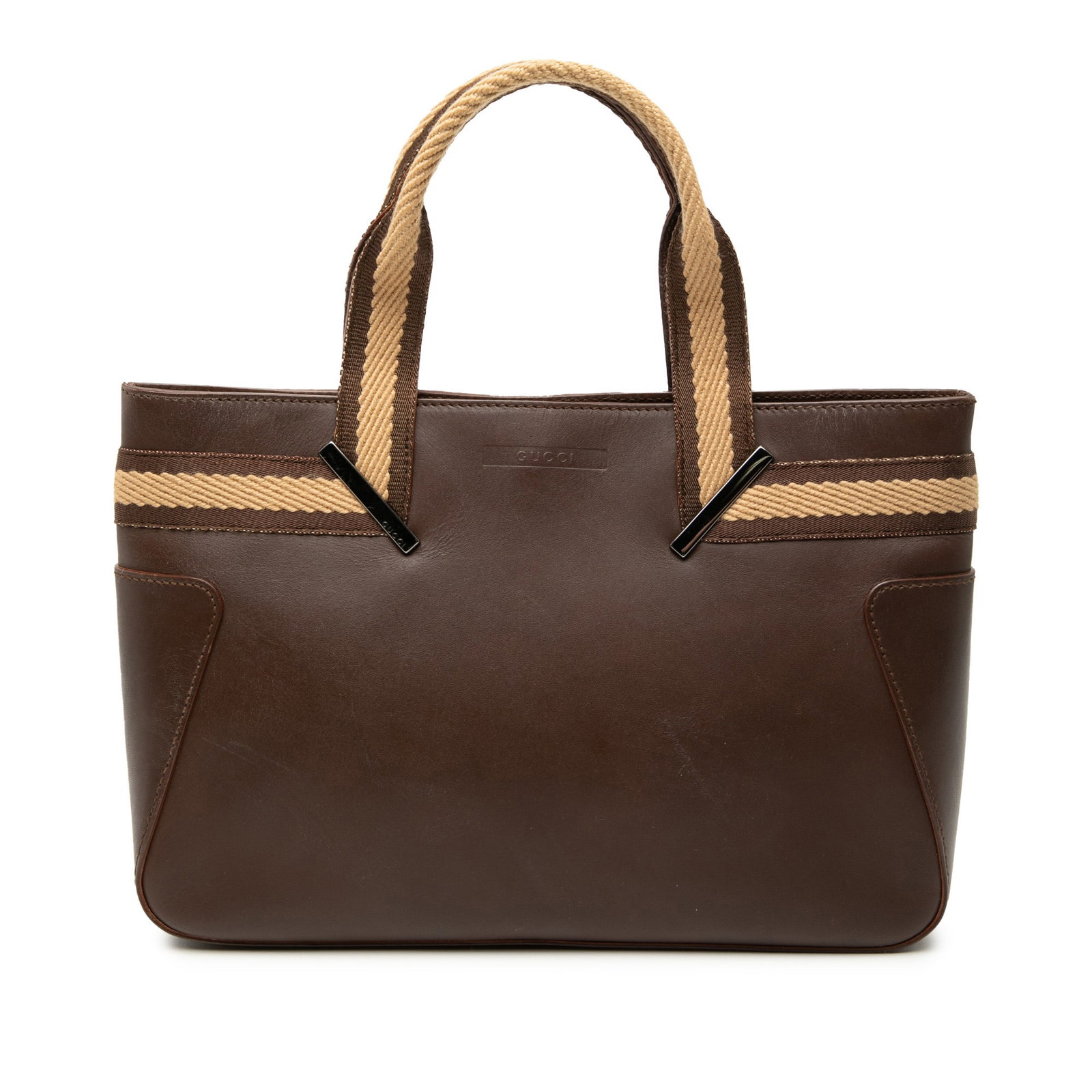 Gucci Brown Leather Tote with Canvas Web Handles: Gucci Brown Leather Tote with Canvas Web Handles This Gucci Leather Web Handbag features a brown leather body with flat canvas handles and trim. It has an open top with a magnetic snap closure and inc