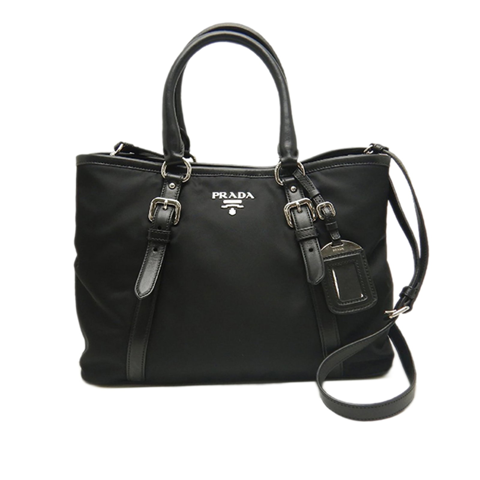 Prada Tessuto Nylon Satchel with Leather Trim and Strap: Prada Tessuto Nylon Satchel with Leather Trim and Strap Prada Soft Calf Trimmed Tessuto Satchel in black, made in Italy. This bag features a nylon body with leather trim, rolled leather handles, a det
