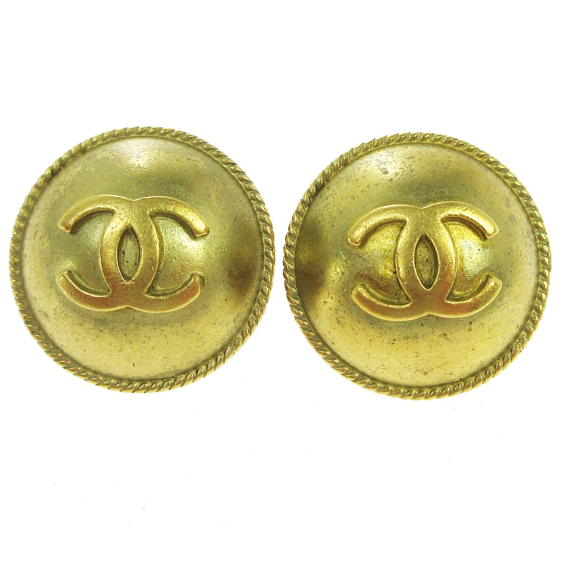 Chanel 94A Gold Tone Button Clip On Logo Earrings: Chanel 94A Gold Tone Button Clip On Logo Earrings Vintage Chanel button earrings with the iconic CC logo motif and a clip-on closure. Made in France, this gold-tone pair is marked 94A and presents in 