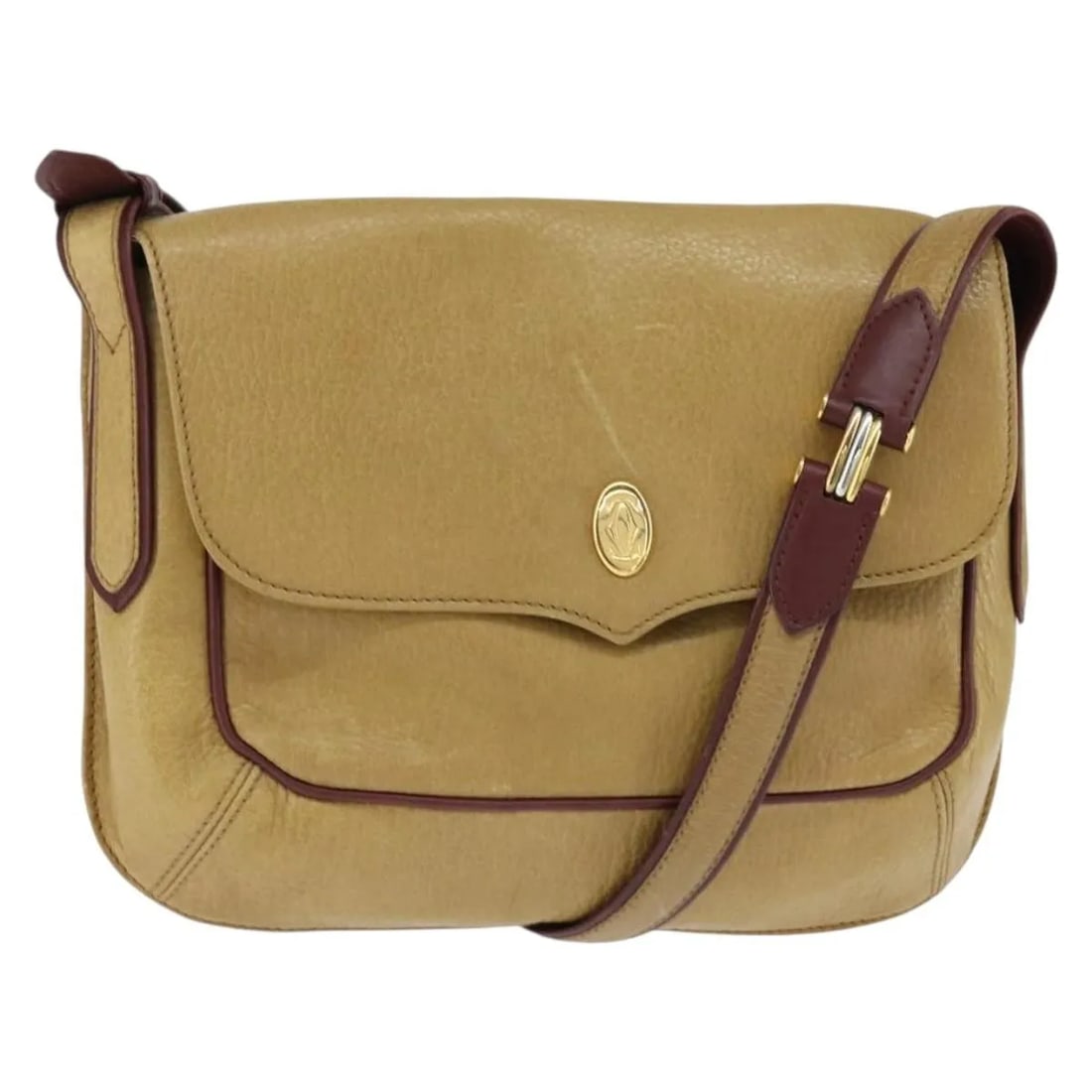 Beige Leather Shoulder Bag Cartier Must de Cartier: Beige Leather Shoulder Bag Cartier Must de Cartier This Must de Cartier shoulder bag is crafted from beige leather and features a classic silhouette. Designed for women, the bag includes a shoulder st