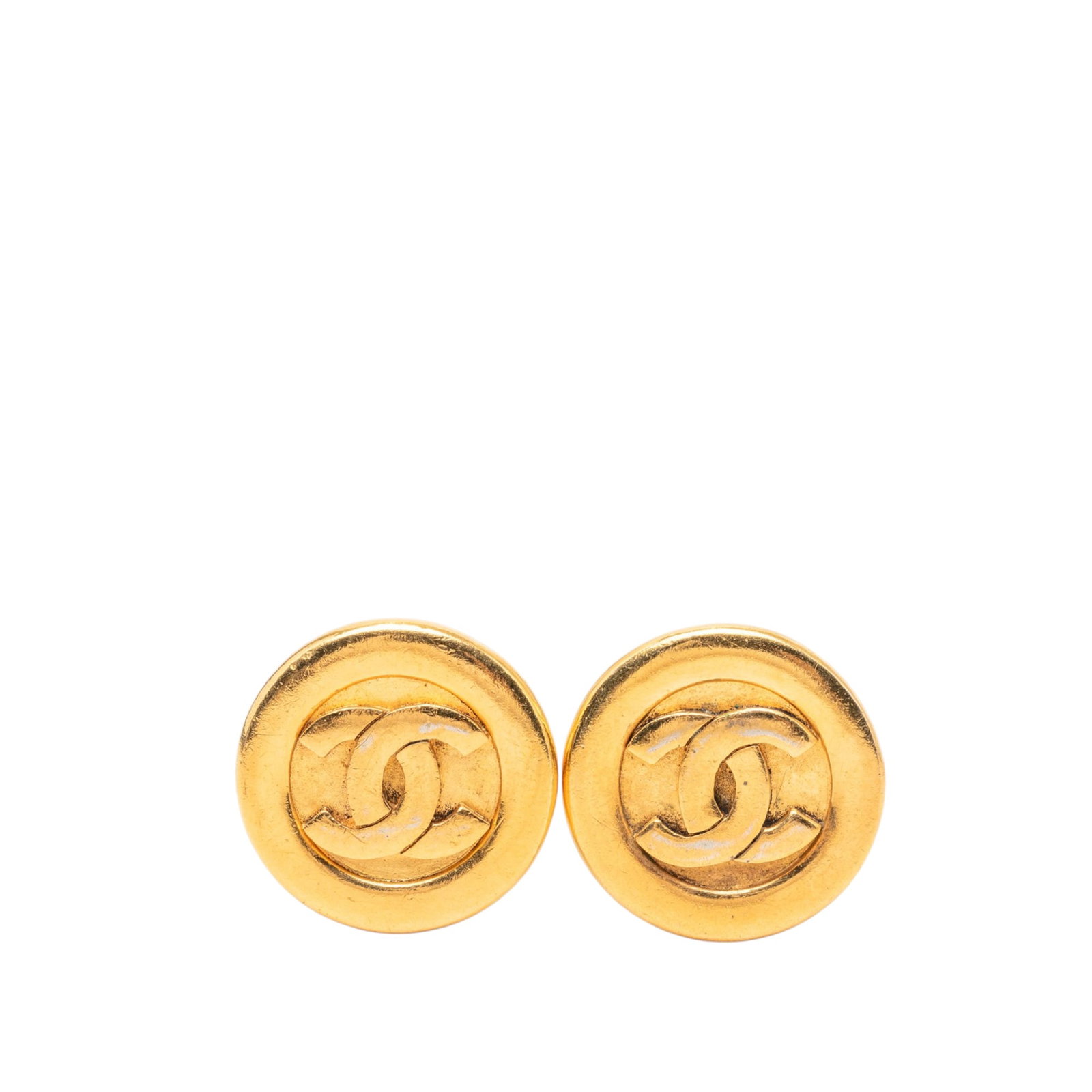 Chanel CC Round Clip On Earrings Gold Plated: Chanel CC Round Clip On Earrings Gold Plated Round clip-on earrings by Chanel with a gold plated metal body and signature CC design. Made in France, this costume jewelry pair has a classic gold-tone l