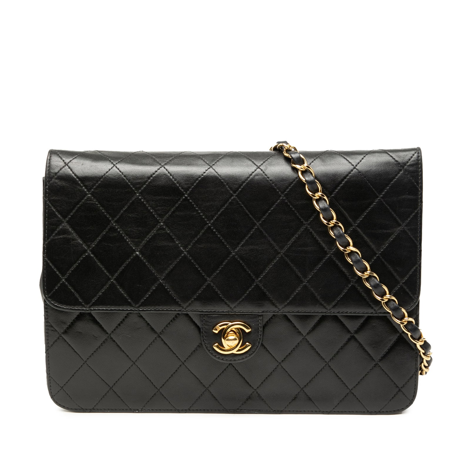 Chanel black quilted lambskin flap bag medium CC: Chanel black quilted lambskin flap bag medium CC This Chanel Medium CC Quilted Lambskin Single Flap shoulder bag features a classic quilted lambskin leather exterior in black, complemented by a leathe