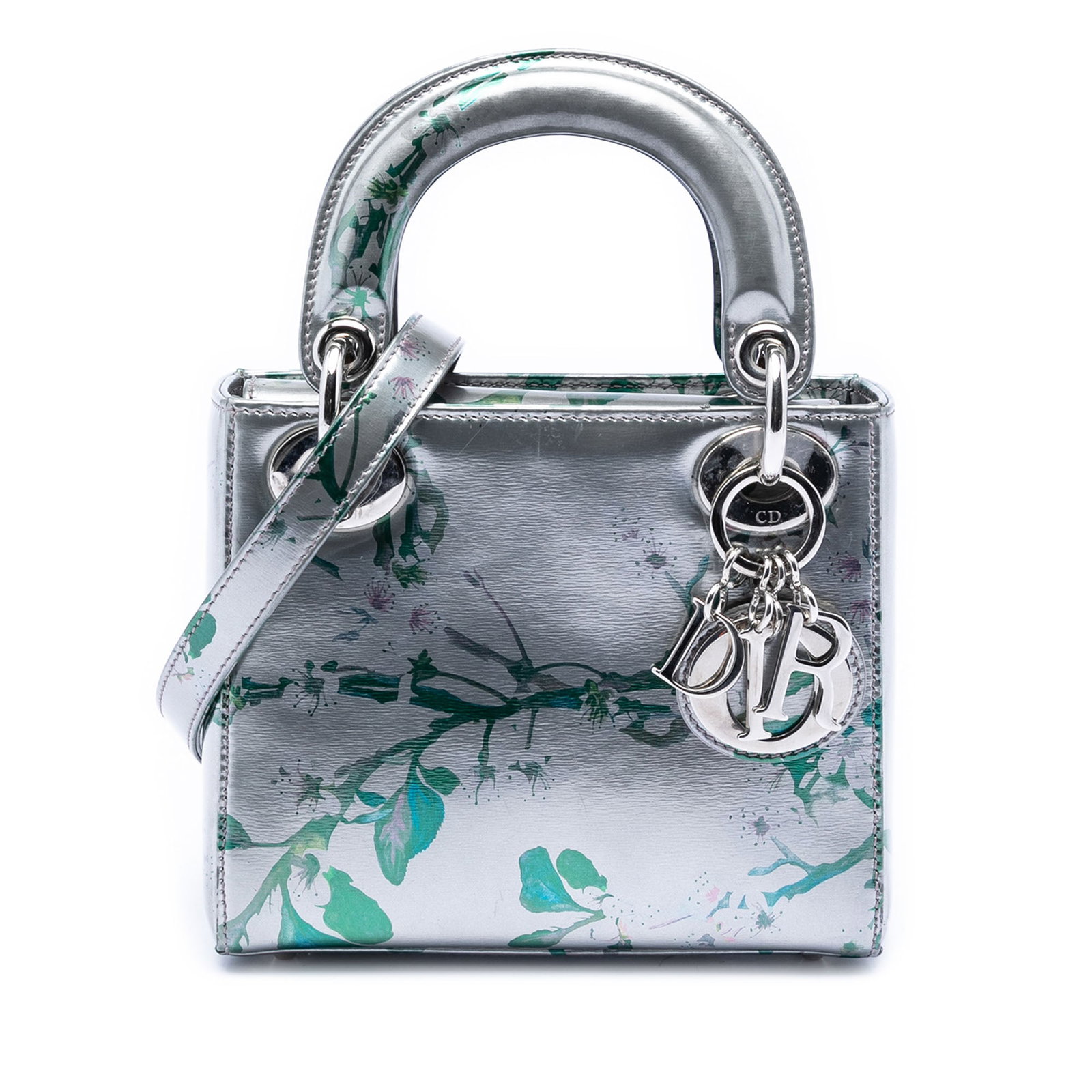 Dior Mini Lady Dior Floral Print Metallic Lambskin Shoulder Bag: Dior Mini Lady Dior Floral Print Metallic Lambskin Shoulder Bag This Mini Lady Dior handbag showcases a floral printed metallic lambskin leather exterior in silver. It features flat top handles, a det
