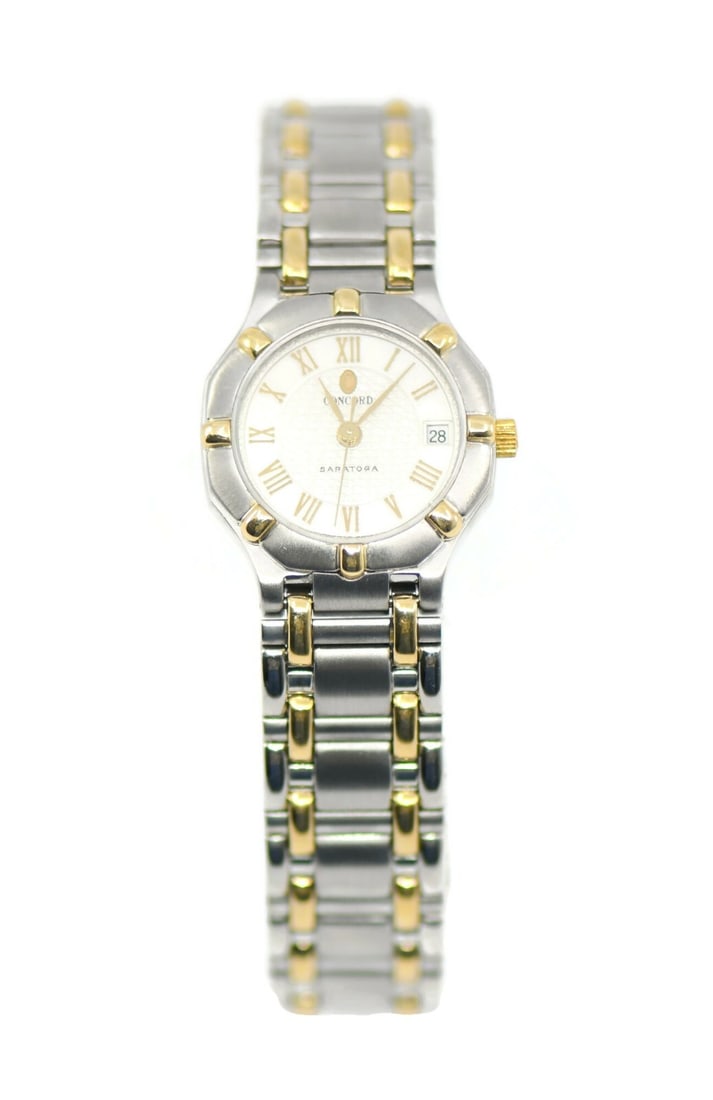 Concord Saratoga Two Tone Stainless Steel Quartz Watch Ref 15.73.287: Concord Saratoga Two Tone Stainless Steel Quartz Watch Ref 15.73.287 This Concord Saratoga Two Tone Stainless Steel Watch features a sophisticated design with a striking silver dial and a durable stai