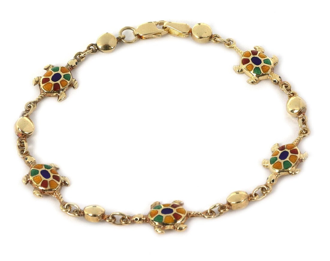 14k Yellow Gold Bead Bracelet with Multicolor Enamel Turtle Charm: 14k Yellow Gold Bead Bracelet with Multicolor Enamel Turtle Charm This vintage estate turtle charm bead bracelet is crafted in 14k yellow gold and accented with a multi-color enamel turtle charm. It f