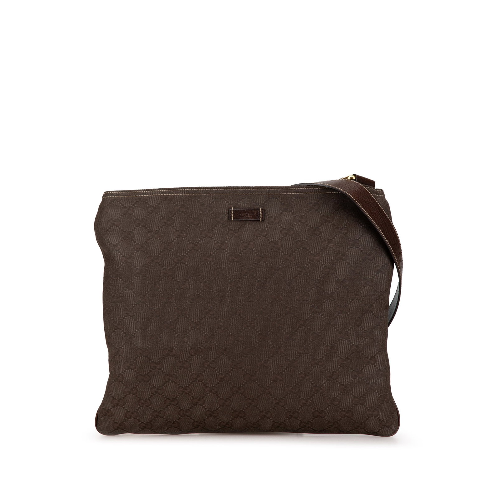 Brown GG Canvas Crossbody Bag by Gucci with Adjustable Leather Strap: Brown GG Canvas Crossbody Bag by Gucci with Adjustable Leather Strap This Gucci GG Canvas Crossbody bag features a canvas body in brown, an adjustable flat leather shoulder strap, a top zip closure, a
