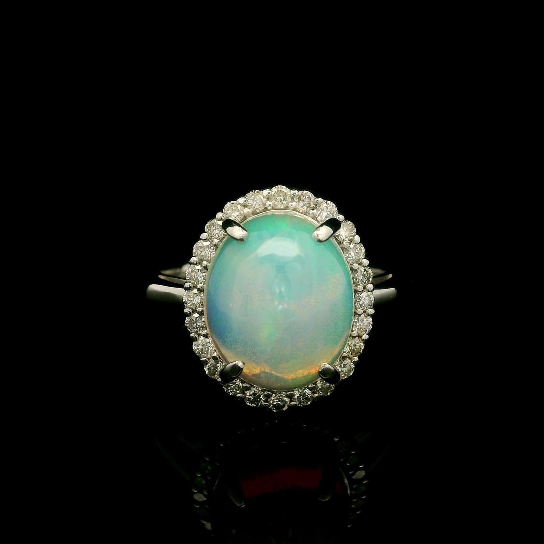 Elegant Platinum 3.19ct Oval Opal Diamond Halo Cocktail Ring: Elegant Platinum 3.19ct Oval Opal Diamond Halo Cocktail Ring This exquisite cocktail ring showcases a stunning 3.19 carat total weight, featuring a natural genuine opal at its center. The opal is an o