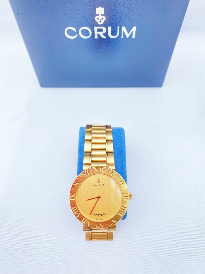 Corum 18K Gold Quartz Watch Water Resistant 34mm 7.5in with Box: Corum 18K Gold Quartz Watch Water Resistant 34mm 7.5in with Box Introducing a stunning 18K yellow gold quartz watch by Corum, dating back to the 1970s-1980s. This exquisite timepiece is in mint condit