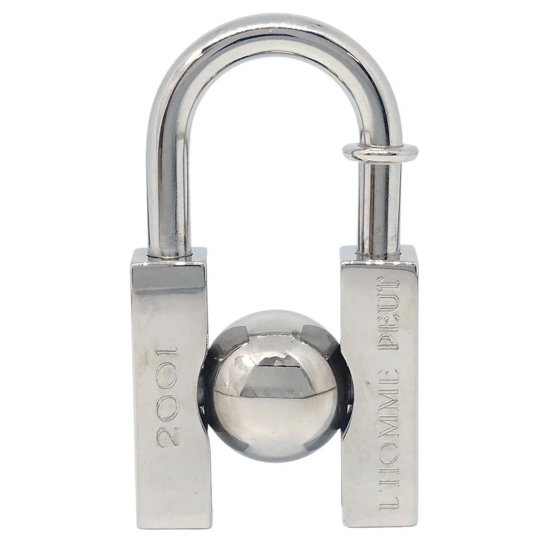 Silver Plated LHomme Peut Embellir La Terre Charm by Hermes: Silver Plated LHomme Peut Embellir La Terre Charm by Hermes This Hermes LHomme Peut Embellir La Terre Cadena Lock Charm is crafted from silver-plated metal and finished in a silver tone. Designed for 