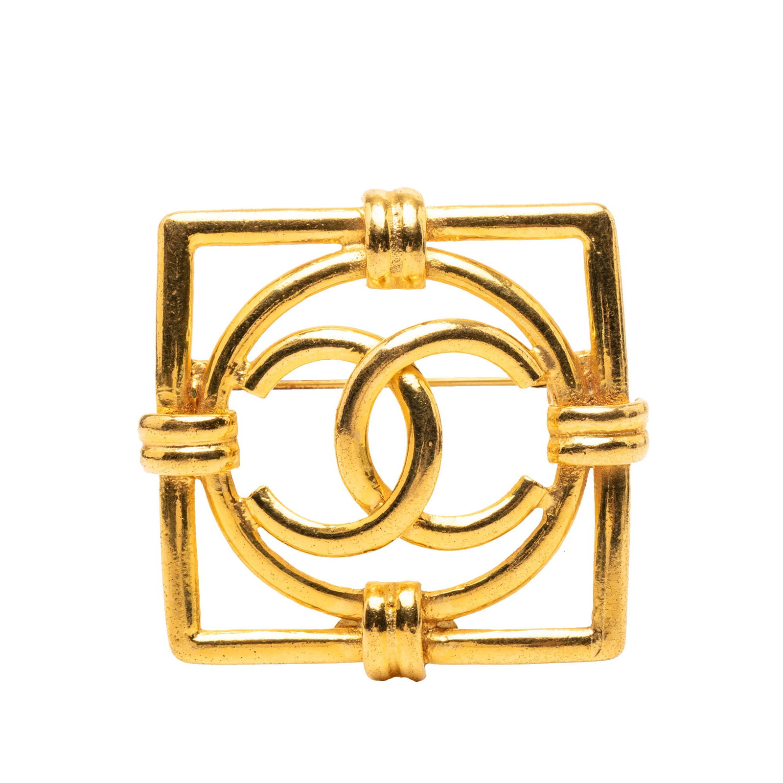 Chanel Square Metal Brooch with Gold Plated Finish: Chanel Square Metal Brooch with Gold Plated Finish This Chanel brooch features a gold-plated metal body in a square design with the iconic CC logo and secures with a back pin closure. Made in France, 