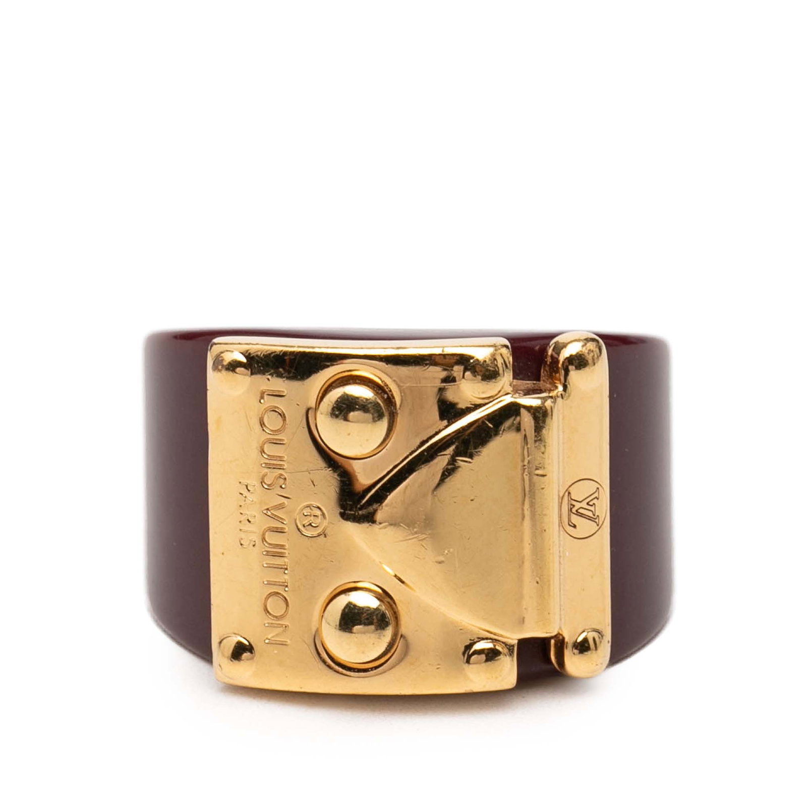 Louis Vuitton Lock Me M resin ring red gold plated: Louis Vuitton Lock Me M resin ring red gold plated This Louis Vuitton Lock Me ring features a resin body with gold plated metal detail. It is a costume piece in red, made in France, and sized at US 6 