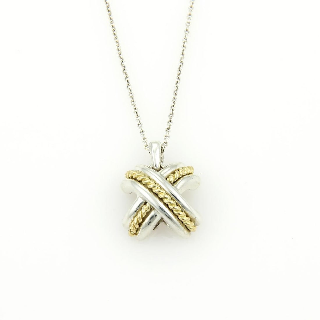 Tiffany & Co. 18k Gold and Sterling Silver Signature X Pendant Necklace: Tiffany & Co. 18k Gold and Sterling Silver Signature X Pendant Necklace Introducing the Tiffany & Co. Signature X Pendant, a stunning blend of elegance and sophistication. This exquisite necklace feat