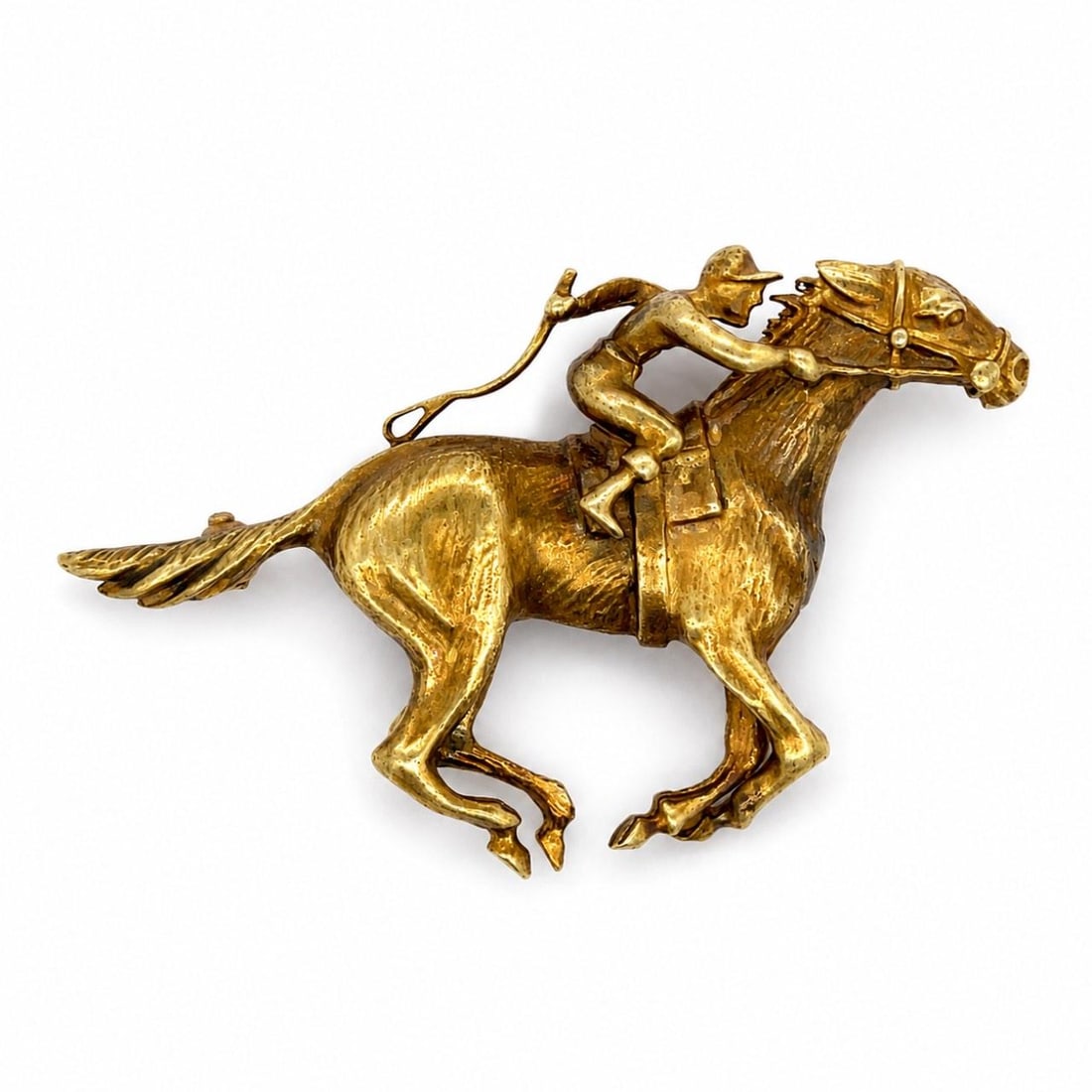 18K Yellow Gold Horse Jockey Brooch 1960s 19.4g: 18K Yellow Gold Horse Jockey Brooch 1960s 19.4g This brooch from the 1960s features a detailed horse and jockey motif crafted in 18K yellow gold. It measures 2 inches in length and weighs 19.4 grams. 