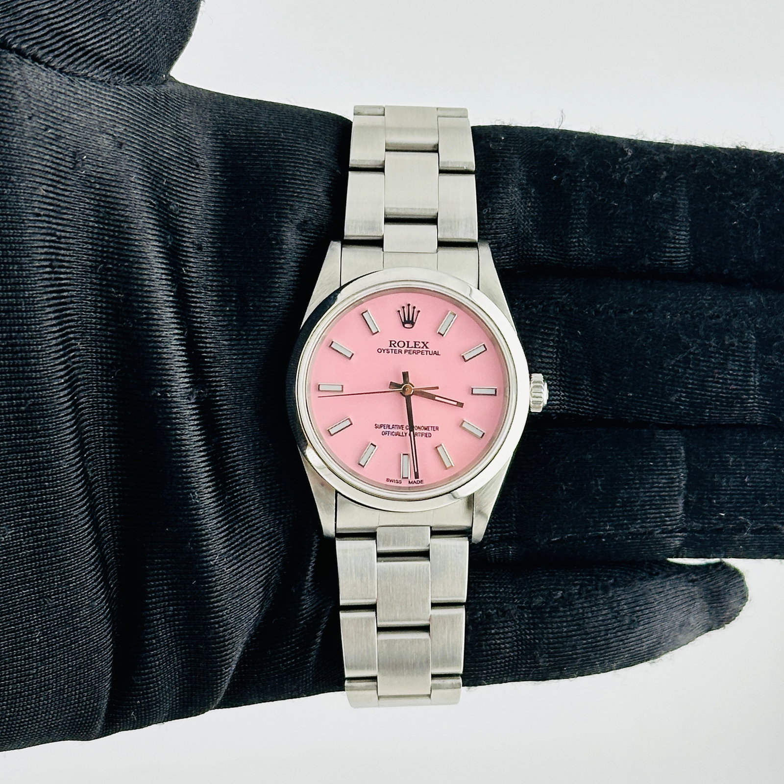 Rolex Ref 14000 Air-King with Aftermarket Pink Stick Dial and Oyster Bracelet: Rolex Ref 14000 Air-King with Aftermarket Pink Stick Dial and Oyster Bracelet This Rolex Air-King features an Aftermarket pink stick dial set within a smooth bezel and is paired with the classic Oyste