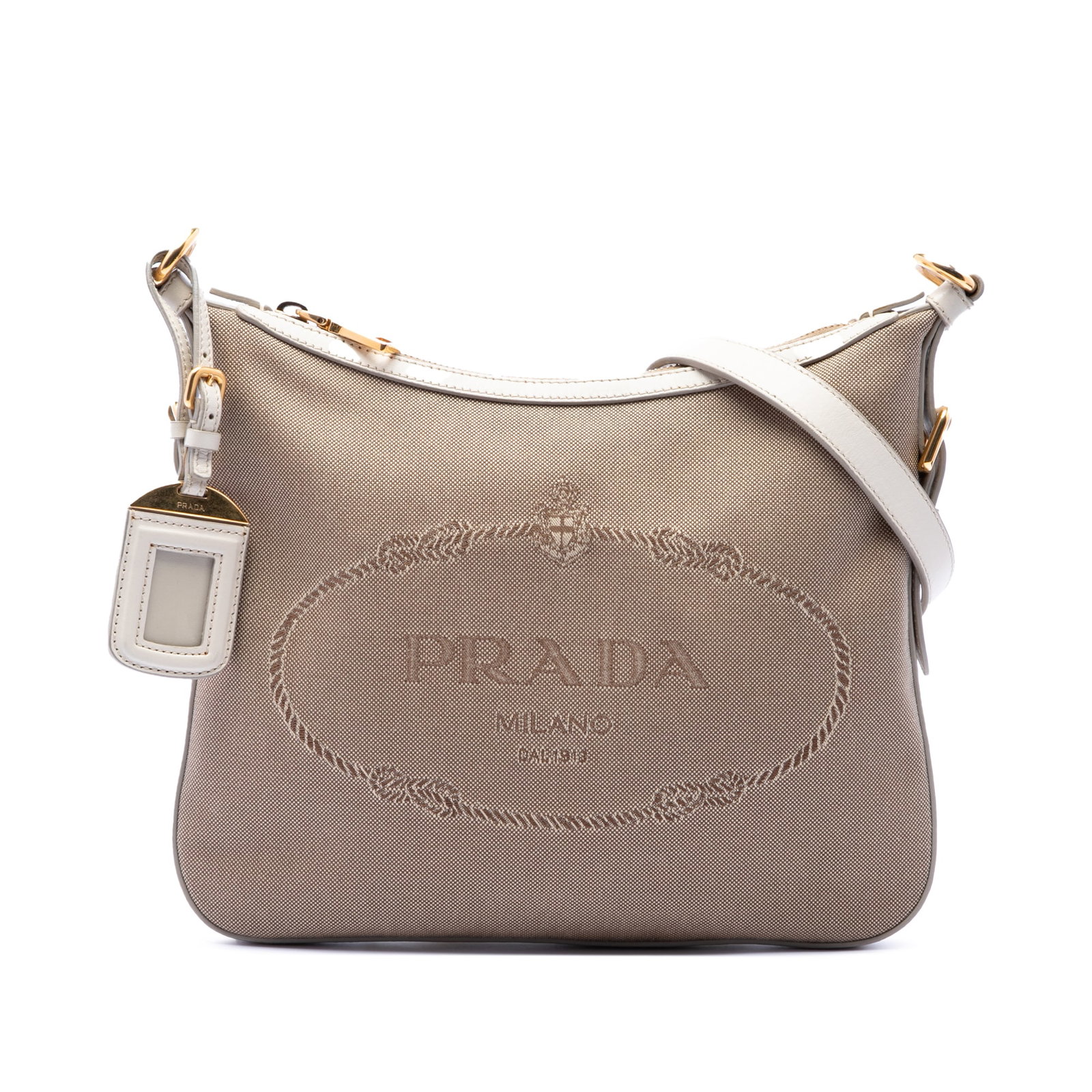 Prada Canapa Logo Canvas Crossbody Bag with Leather Trim: Prada Canapa Logo Canvas Crossbody Bag with Leather Trim Prada Canvas Canapa Logo Crossbody bag in beige, featuring a canvas body with leather trim, an adjustable flat leather strap, a top zip closure