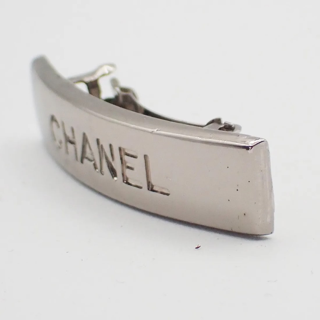 Chanel Logo Metal Hair Barrette Silver France: Chanel Logo Metal Hair Barrette Silver France A Chanel logo hair barrette designed for women, made of metal in a silver color. It measures 5 cm wide and 1 cm high and was made in France. Condition is 
