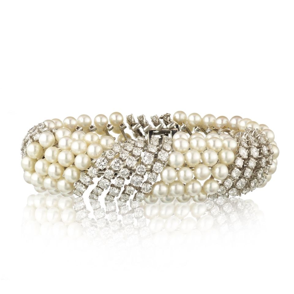David Webb 1970s Platinum 18K White Gold Pearl Diamond Bracelet: David Webb 1970s Platinum 18K White Gold Pearl Diamond Bracelet This exquisite bracelet is a stunning combination of luxury and craftsmanship, featuring spiraling strands of lustrous white pearls inte