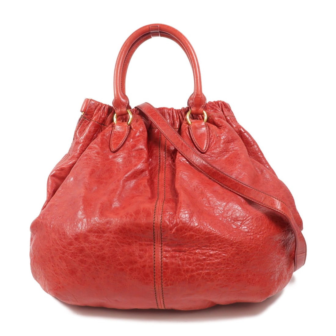 Miu Miu calfskin 2 way shoulder bag red with strap: Miu Miu calfskin 2 way shoulder bag red with strap Two-way shoulder bag in red calfskin leather with gold-tone hardware. It features a magnetic pocket, one inside zip pocket, and comes with a shoulder