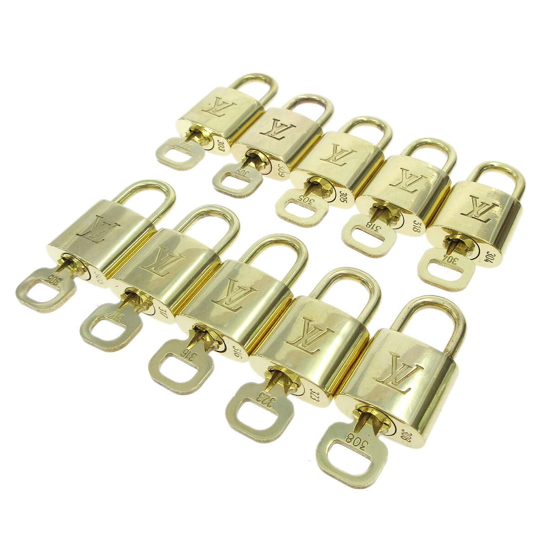 Louis Vuitton 10 Piece Gold Tone Padlock and Key Charm Set: Louis Vuitton 10 Piece Gold Tone Padlock and Key Charm Set Set of 10 Louis Vuitton padlock and key bag accessories charms in a gold-tone finish. Made in France, this unisex accessory set shows overall