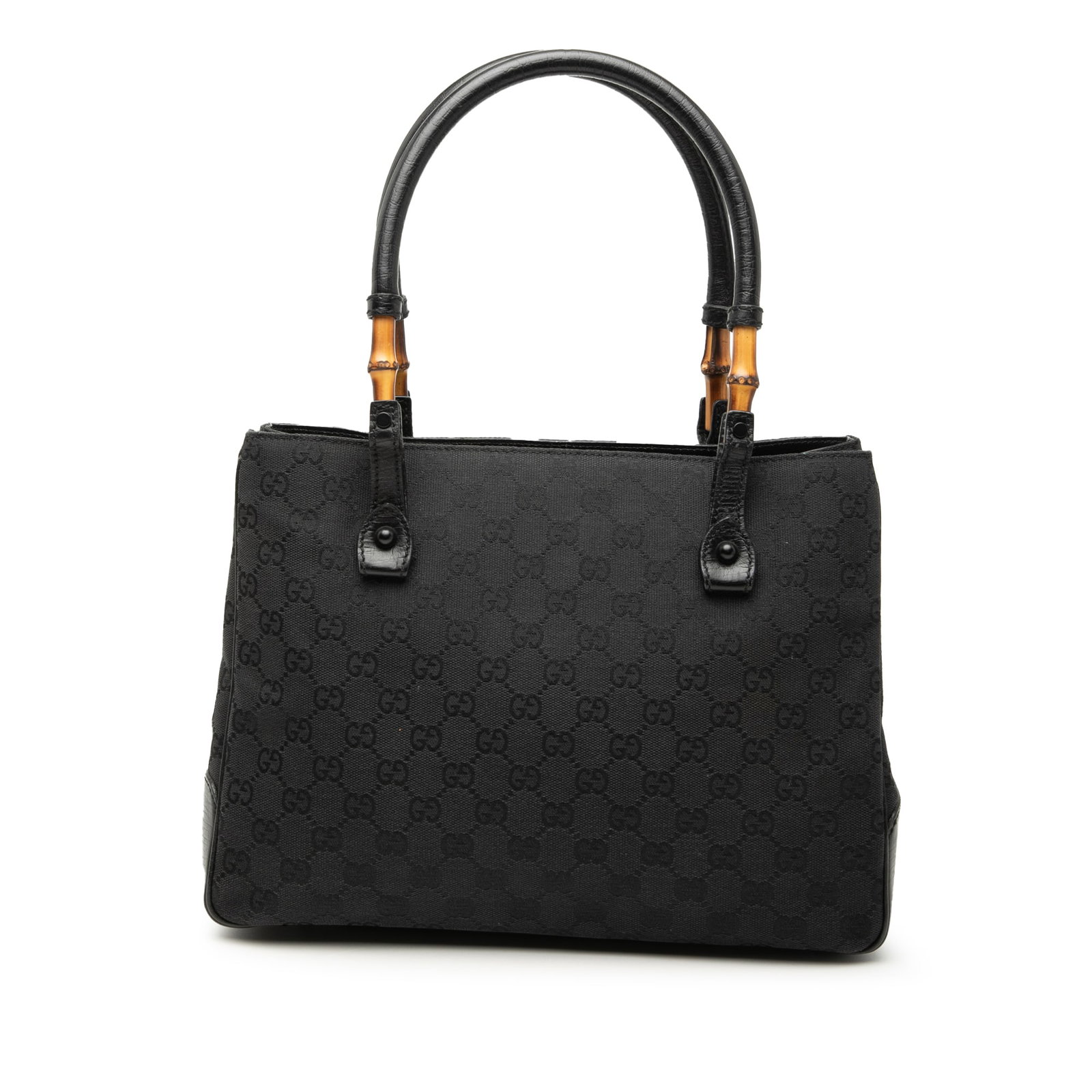 Gucci Bamboo Tote Black GG Canvas Bag: Gucci Bamboo Tote Black GG Canvas Bag This Gucci GG Canvas Bamboo Tote features a canvas body with leather trim, rolled leather handles accented with bamboo detail, an open top, and an interior zip po