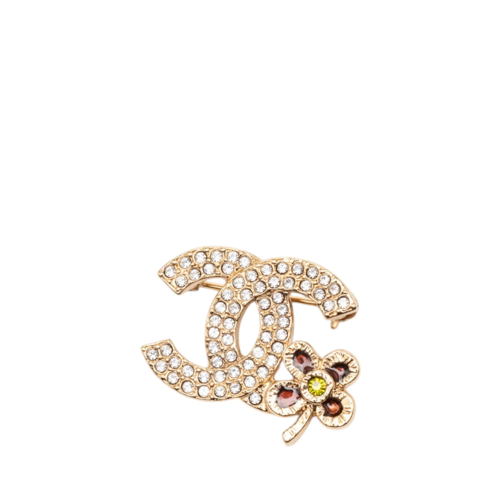 Chanel gold-tone crystal clover leaf brooch: Chanel gold-tone crystal clover leaf brooch This Chanel CC Gold Plated Strass Clover Leaf Pin Brooch features a gold-tone metal construction adorned with crystals and is designed with a back pin closu