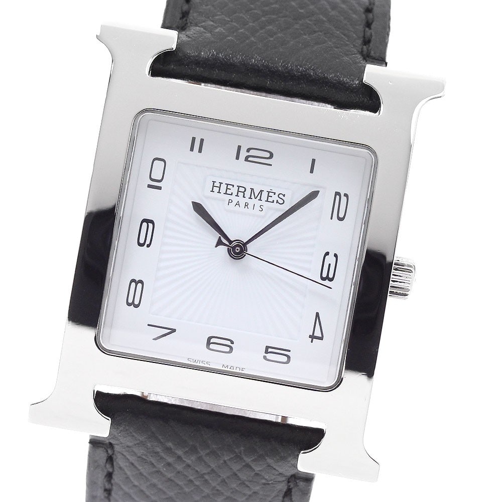 Hermes H-Watch HH1.810 mens quartz wristwatch: Hermes H-Watch HH1.810 mens quartz wristwatch HERMES H-Watch Quartz men's wristwatch, model HH1.810, made in Switzerland. This pre-owned watch features a stainless steel case, leather belt, white dial