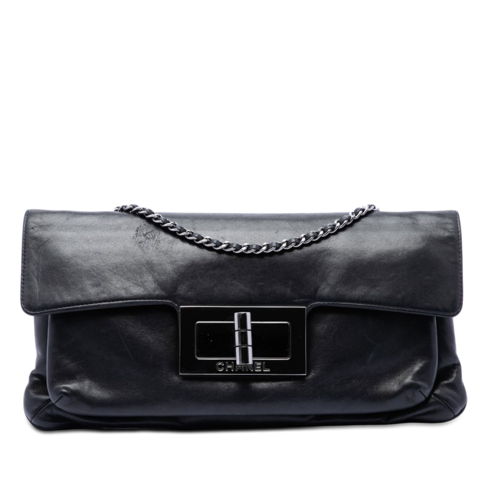 Chanel Giant Mademoiselle Turnlock Flap Lambskin Shoulder Bag Black: Chanel Giant Mademoiselle Turnlock Flap Lambskin Shoulder Bag Black This Chanel shoulder bag features a velour body in black leather, a silver-tone woven chain, and a front flap with an oversized reis