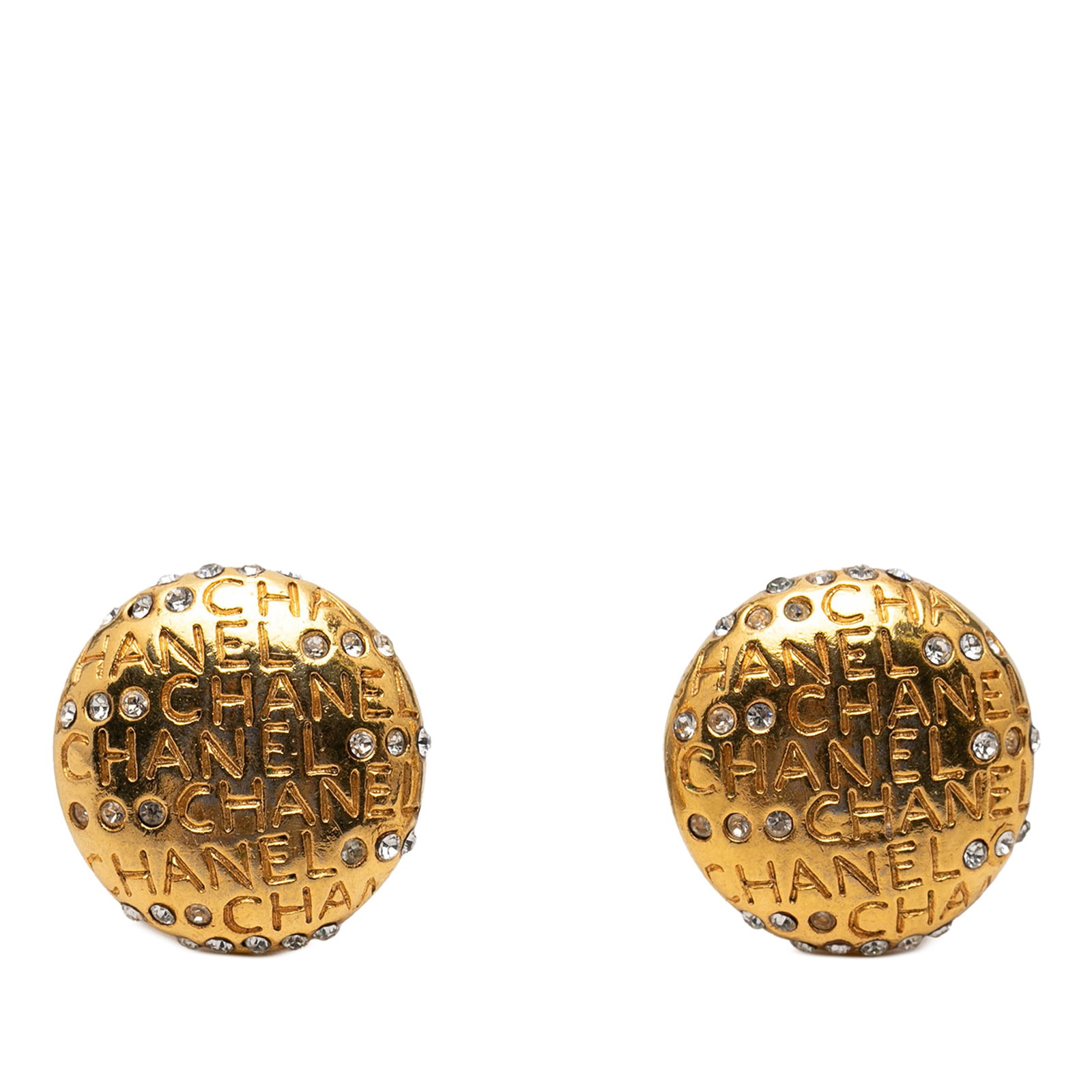 Chanel gold plated strass clip on earrings: Chanel gold plated strass clip on earrings These Chanel clip-on earrings feature gold-plated metal bodies adorned with strass embellishments and the signature logo lettering. Designed as costume jewel