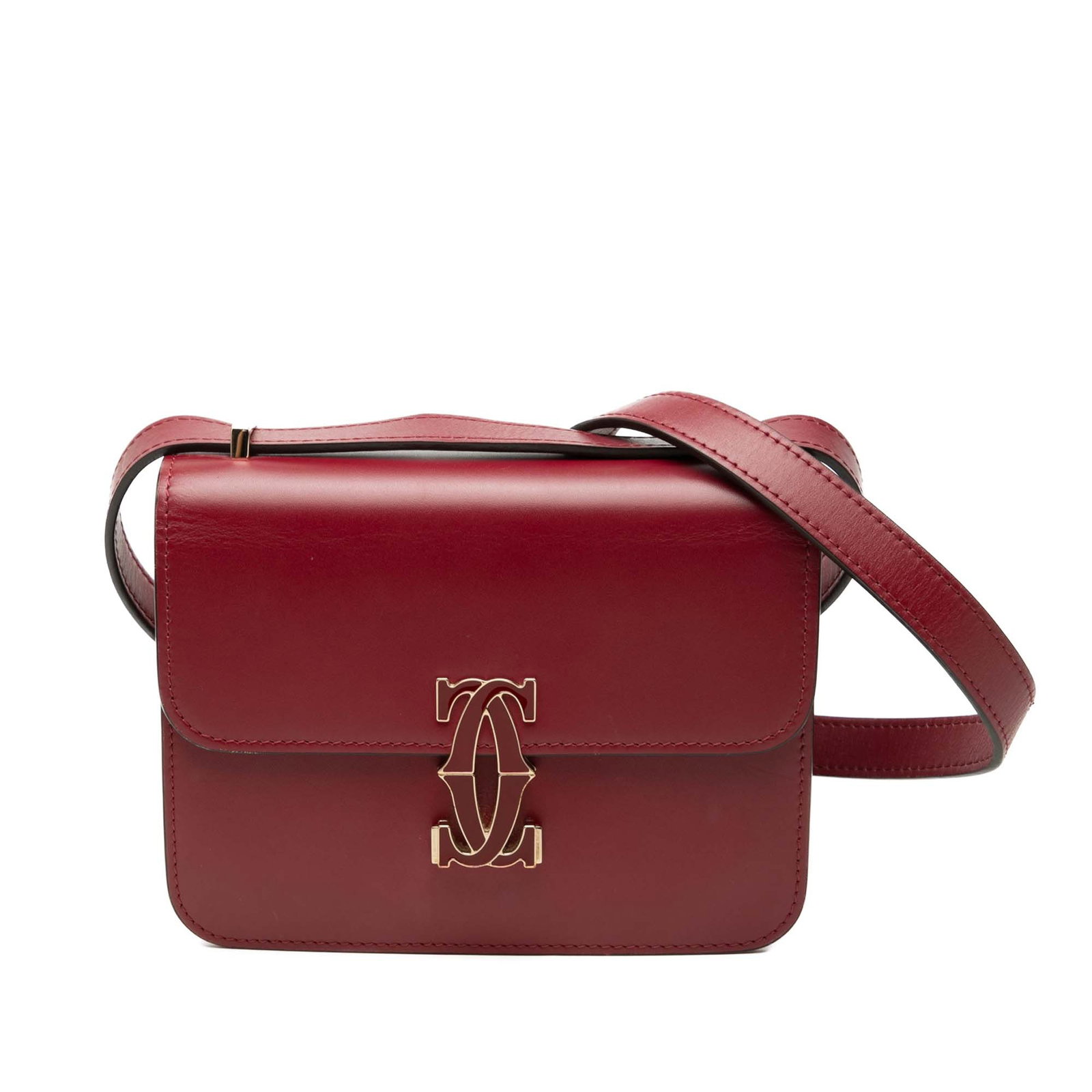 Cartier C de Cartier Mini Red Leather Crossbody Bag: Cartier C de Cartier Mini Red Leather Crossbody Bag This Mini Leather C de Cartier Crossbody is a red leather bag made in Italy. It features a flat leather shoulder strap, a front flap with magnetic s