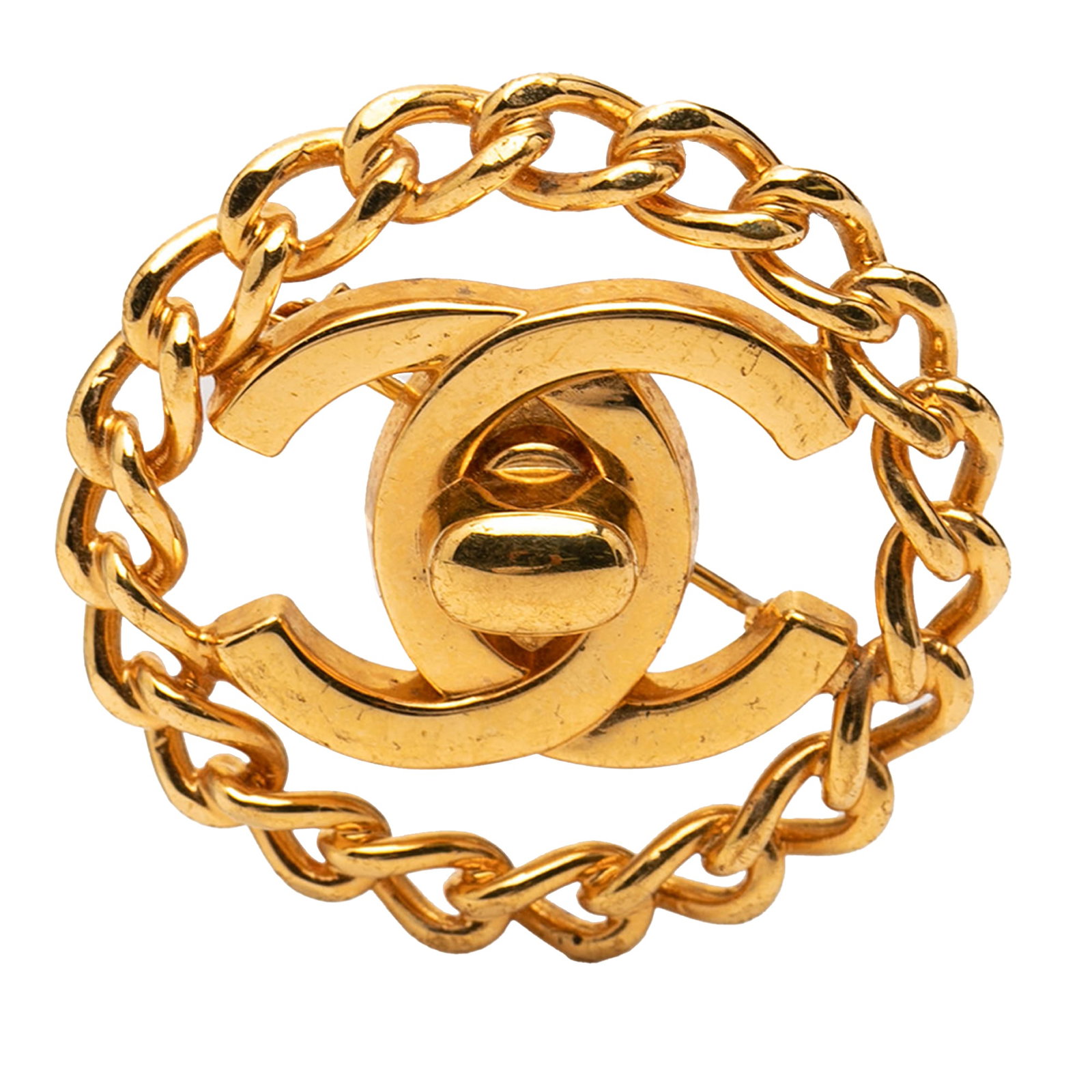 Chanel CC Turnlock Chain Brooch Gold Tone Metal: Chanel CC Turnlock Chain Brooch Gold Tone Metal Chanel Gold Plated CC Turnlock Chain Brooch with a gold-tone metal body and back pin closure. Made in France, this costume jewelry piece features the ic