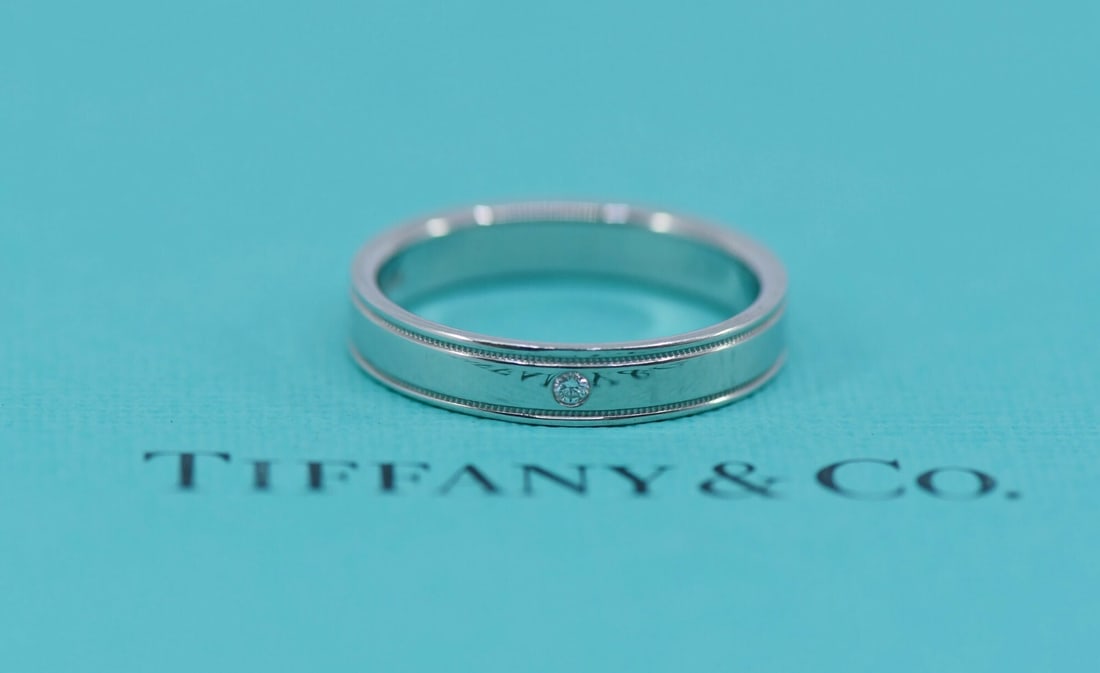 Tiffany & Co Diamond Milgrain Platinum Ring 8.5 Authentic: Tiffany & Co Diamond Milgrain Platinum Ring 8.5 Authentic This exquisite Tiffany & Co. Diamond Double Milgrain Ring showcases timeless elegance and craftsmanship. Crafted from high-quality 950 platinu