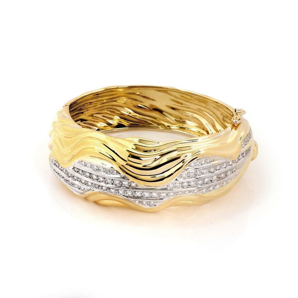 Sal Praschnik 18k Two Tone Gold Wave Dome Bracelet 2.5ct Diamonds: Sal Praschnik 18k Two Tone Gold Wave Dome Bracelet 2.5ct Diamonds This stunning wide bracelet by designer Sal Praschnik showcases a chic and fashionable design, expertly crafted from 18k yellow and wh