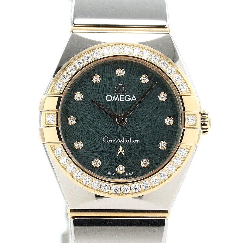 Omega Constellation Quartz 25mm Moonshine Gold Steel Diamond Bezel: Omega Constellation Quartz 25mm Moonshine Gold Steel Diamond Bezel This OMEGA Constellation Quartz 25mm women's wristwatch showcases refined Swiss craftsmanship. The watch features a pine green supern