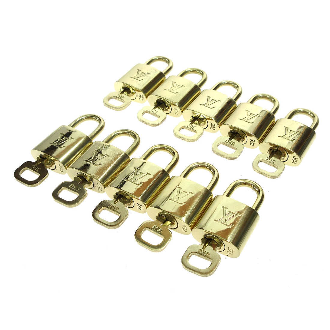 Louis Vuitton 10 Piece Padlock and Key Charm Set Gold Tone: Louis Vuitton 10 Piece Padlock and Key Charm Set Gold Tone Set of 10 Louis Vuitton padlock and key bag accessory charms in a gold-tone finish. Made in France, this unisex set shows overall signs of us