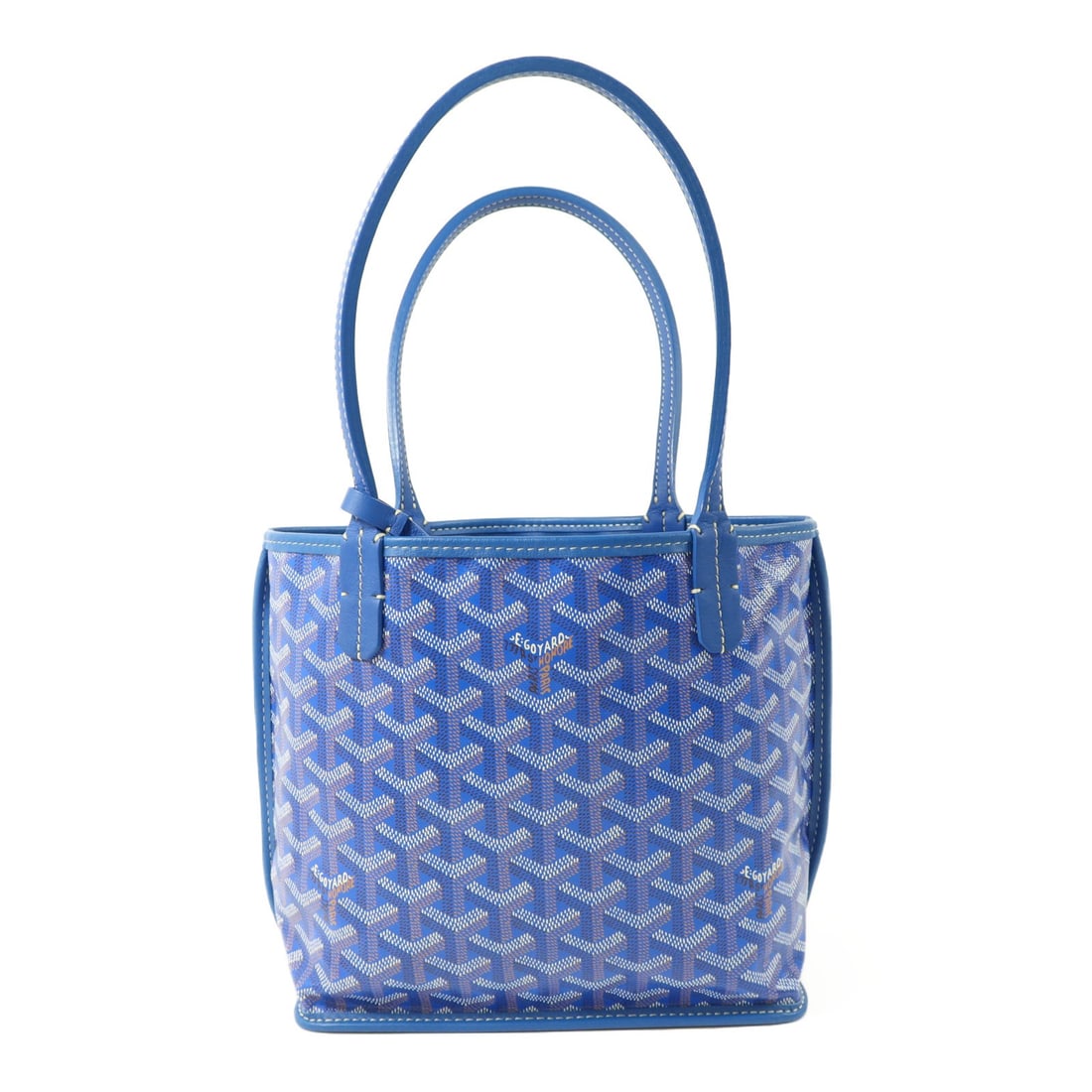 Goyard Anjou Mini Blue Coated Canvas Tote Bag ANJOUSMINCG: Goyard Anjou Mini Blue Coated Canvas Tote Bag ANJOUSMINCG A mini tote bag in blue from the Anjou line, made from PVC coated canvas. It features a compact silhouette with a handle drop of 40 cm and com