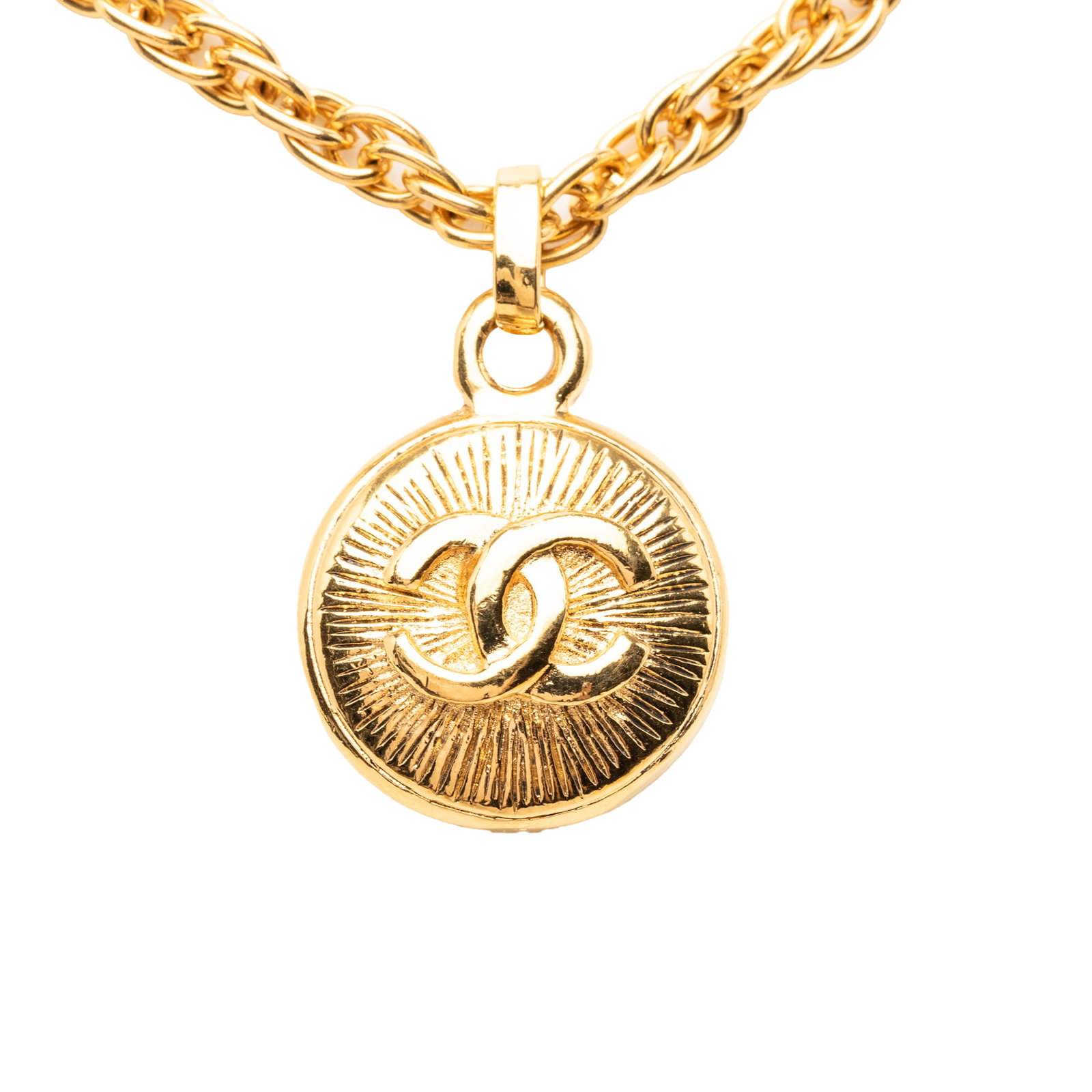 Chanel CC Sunburst Medallion Pendant Necklace Gold Tone Metal: Chanel CC Sunburst Medallion Pendant Necklace Gold Tone Metal Gold-tone metal necklace featuring a medallion sunburst pendant and a spring ring closure. Made in France and classified as costume jewelr