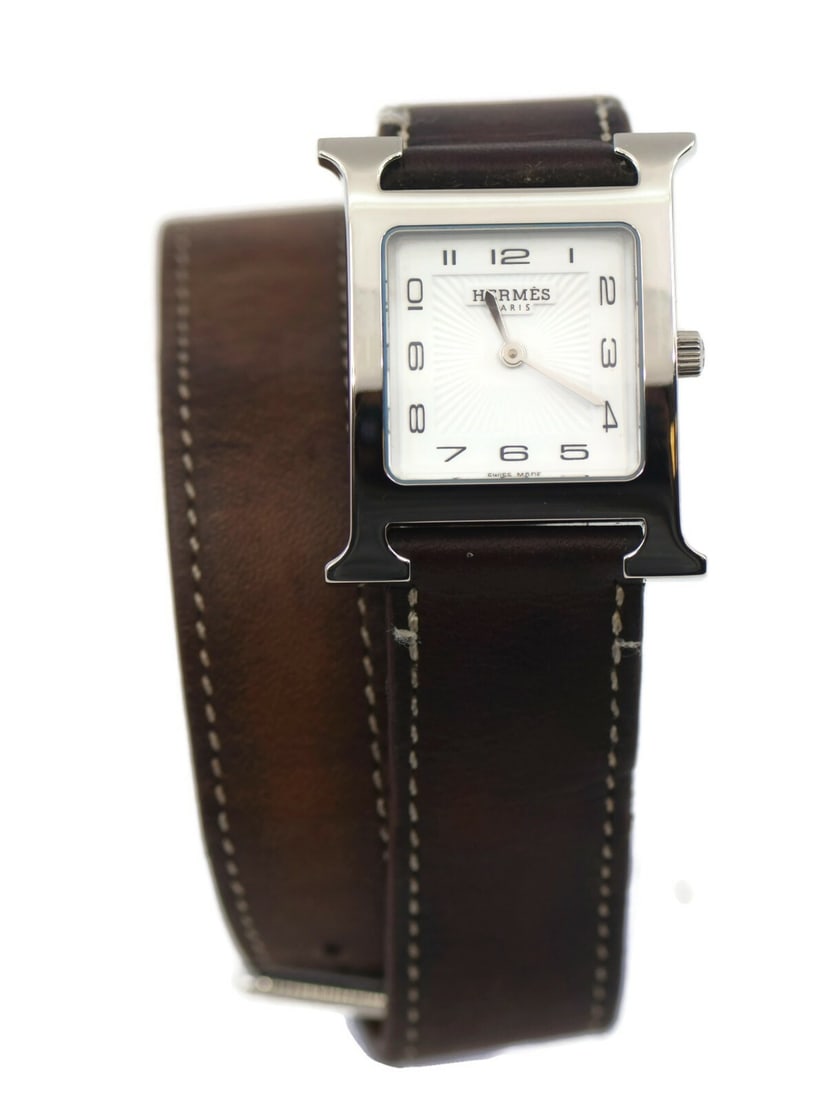 Hermes H Hour Quartz Watch HH1.510 Stainless Steel Leather Band: Hermes H Hour Quartz Watch HH1.510 Stainless Steel Leather Band This Hermes H Hour wristwatch combines elegance and functionality, featuring a sleek stainless steel case with a diameter of 25mm. The w