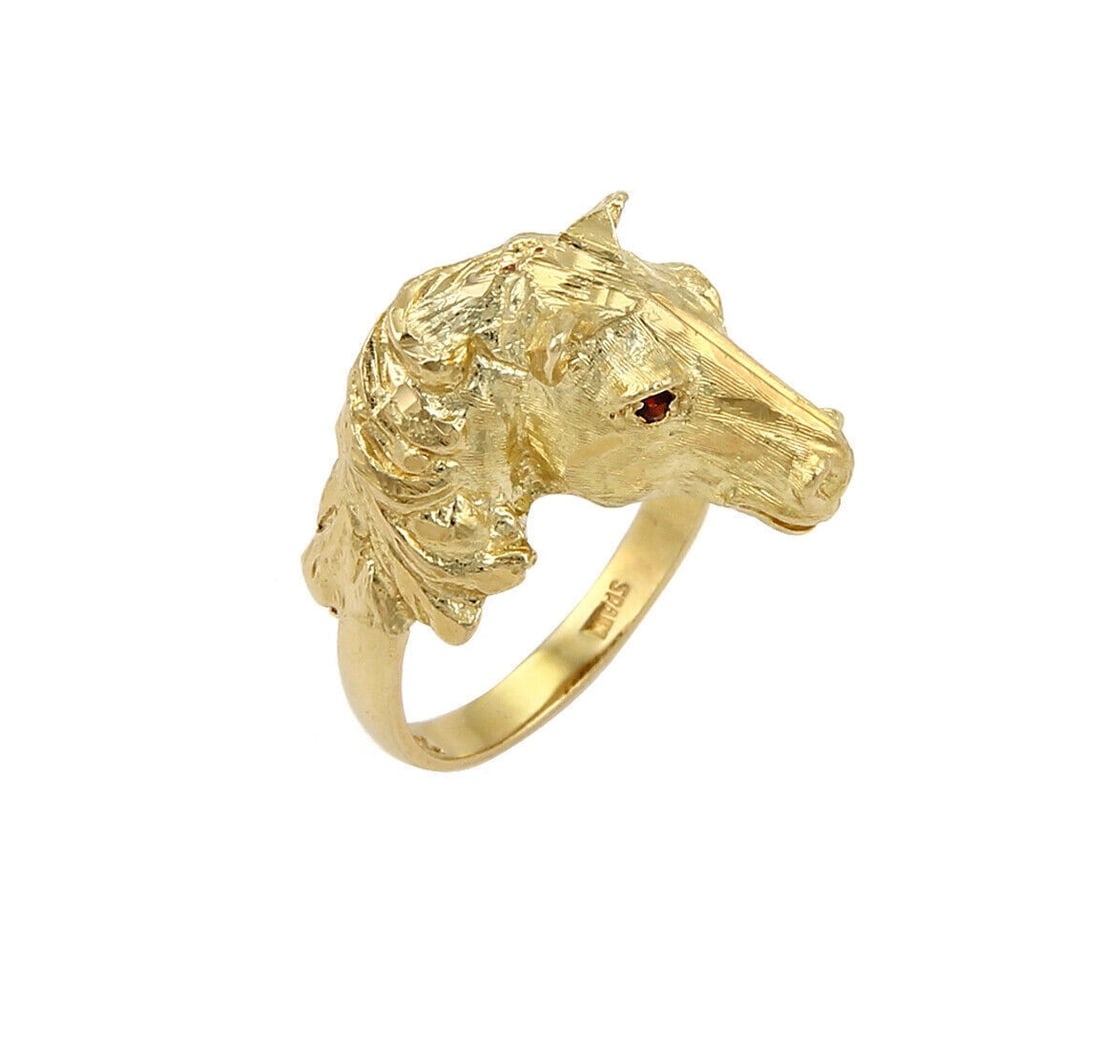 18K Yellow Gold Equestrian Ring with Ruby Eyes Size 5.5: 18K Yellow Gold Equestrian Ring with Ruby Eyes Size 5.5 Vintage estate horse head ring crafted in solid 18k yellow gold with ruby-set eyes totaling approximately 0.04 ct. The ring is size 5.5 and feat