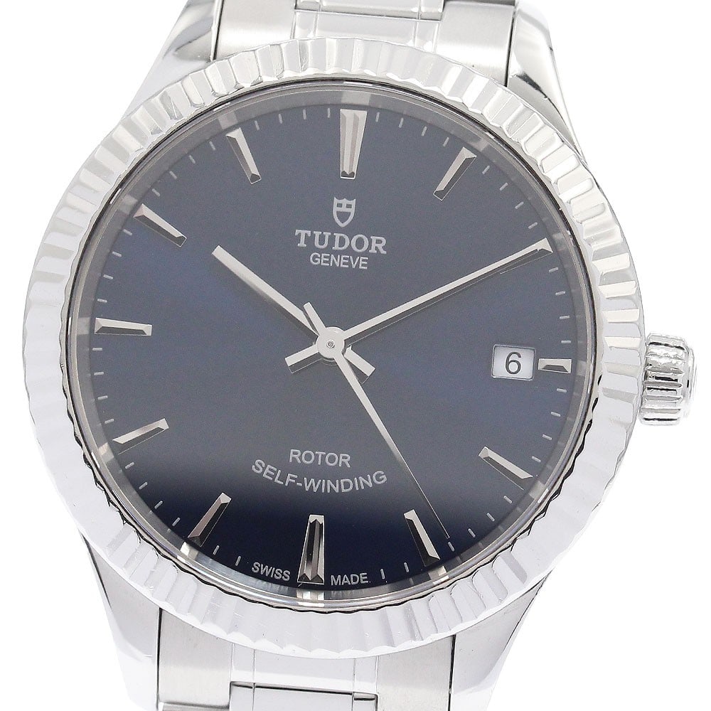 TUDOR Style 12310 Automatic Date Unisex Wristwatch: TUDOR Style 12310 Automatic Date Unisex Wristwatch TUDOR Style Date automatic wristwatch, reference 12310, in pre-owned condition. It features a stainless steel case and band, a blue dial, and a date 