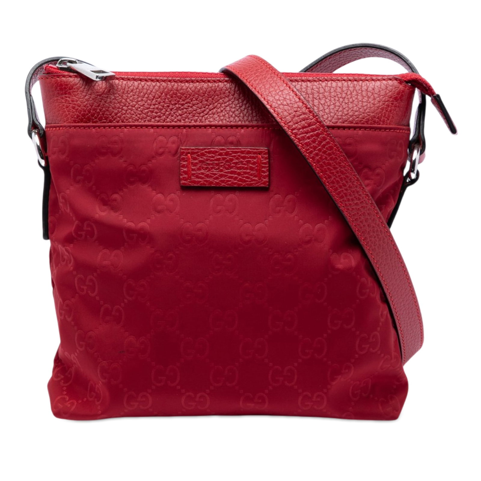 Gucci GG Nylon Red Crossbody Bag: Gucci GG Nylon Red Crossbody Bag This Gucci GG Nylon Crossbody bag features a durable nylon body with leather trim, an adjustable flat leather strap, and a top zip closure. The bag includes an exterio