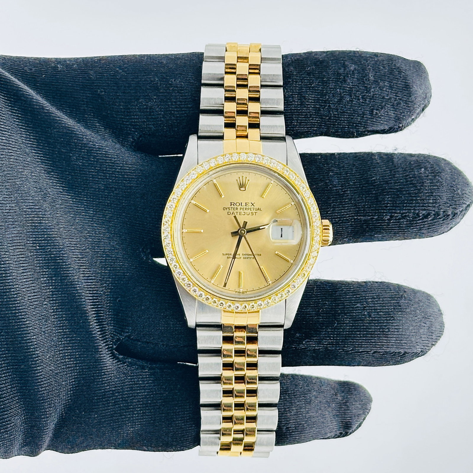 Rolex Datejust 16013 Champagne Dial Jubilee Bracelet Mens: Rolex Datejust 16013 Champagne Dial Jubilee Bracelet Mens This Rolex Datejust features a champagne stick dial and is paired with a D-Link Jubilee bracelet. The watch is equipped with a fluted bezel an