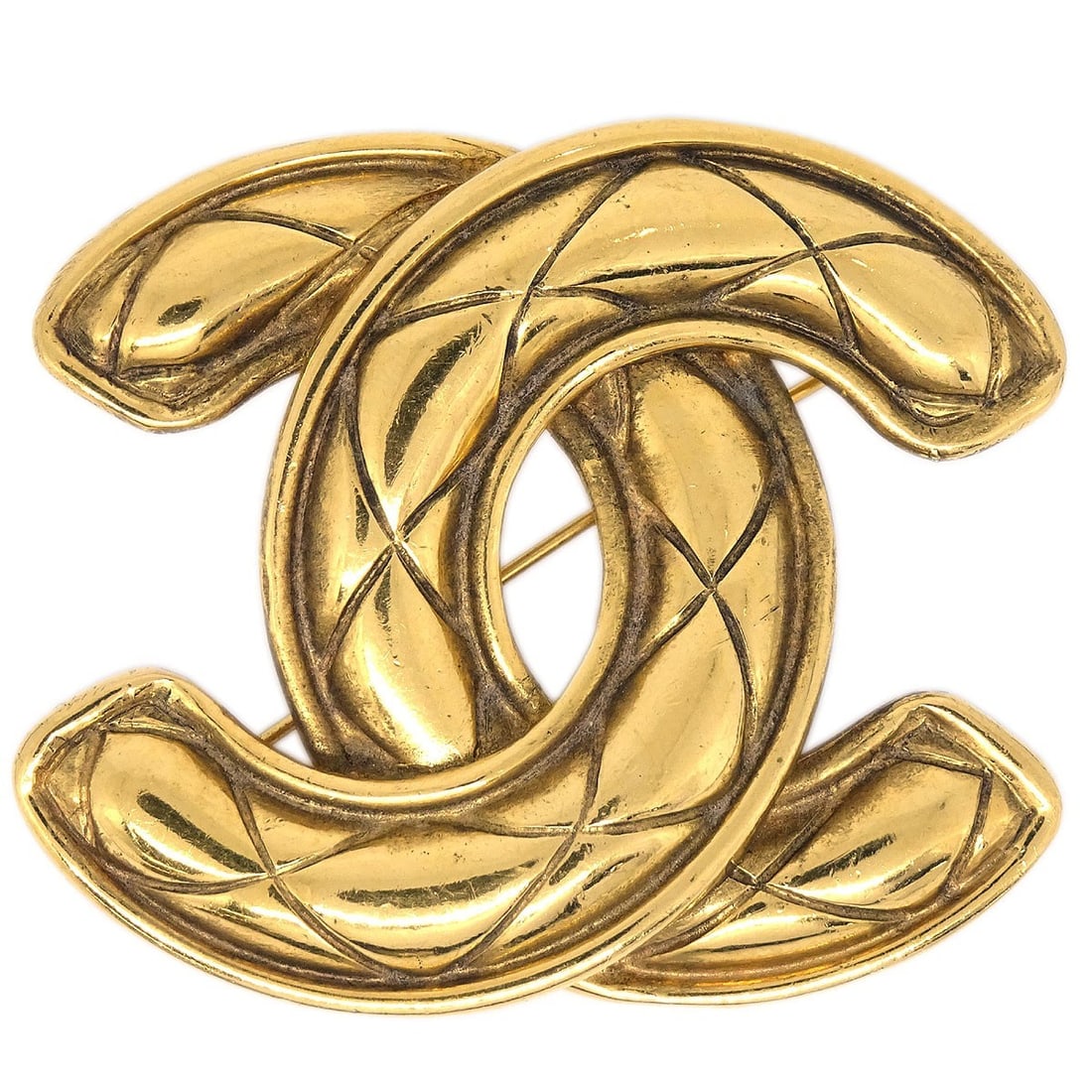 CHANEL Quilted CC Logo Brooch Gold Plated France: CHANEL Quilted CC Logo Brooch Gold Plated France Large Chanel quilted CC brooch pin in gold-plated metal. This logo-themed brooch was made in France and comes with no accessories. Condition is very go