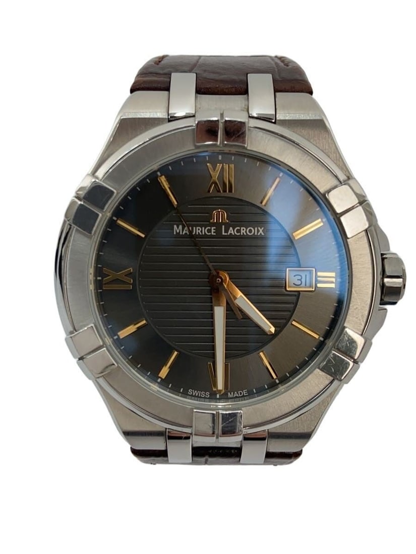 Maurice Lacroix Icon black leather quartz men's wristwatch: Maurice Lacroix Icon black leather quartz men's wristwatch This Maurice Lacroix Icon Quartz AX39550 is a men's wristwatch featuring a classic black design. The watch is crafted with a leather band and