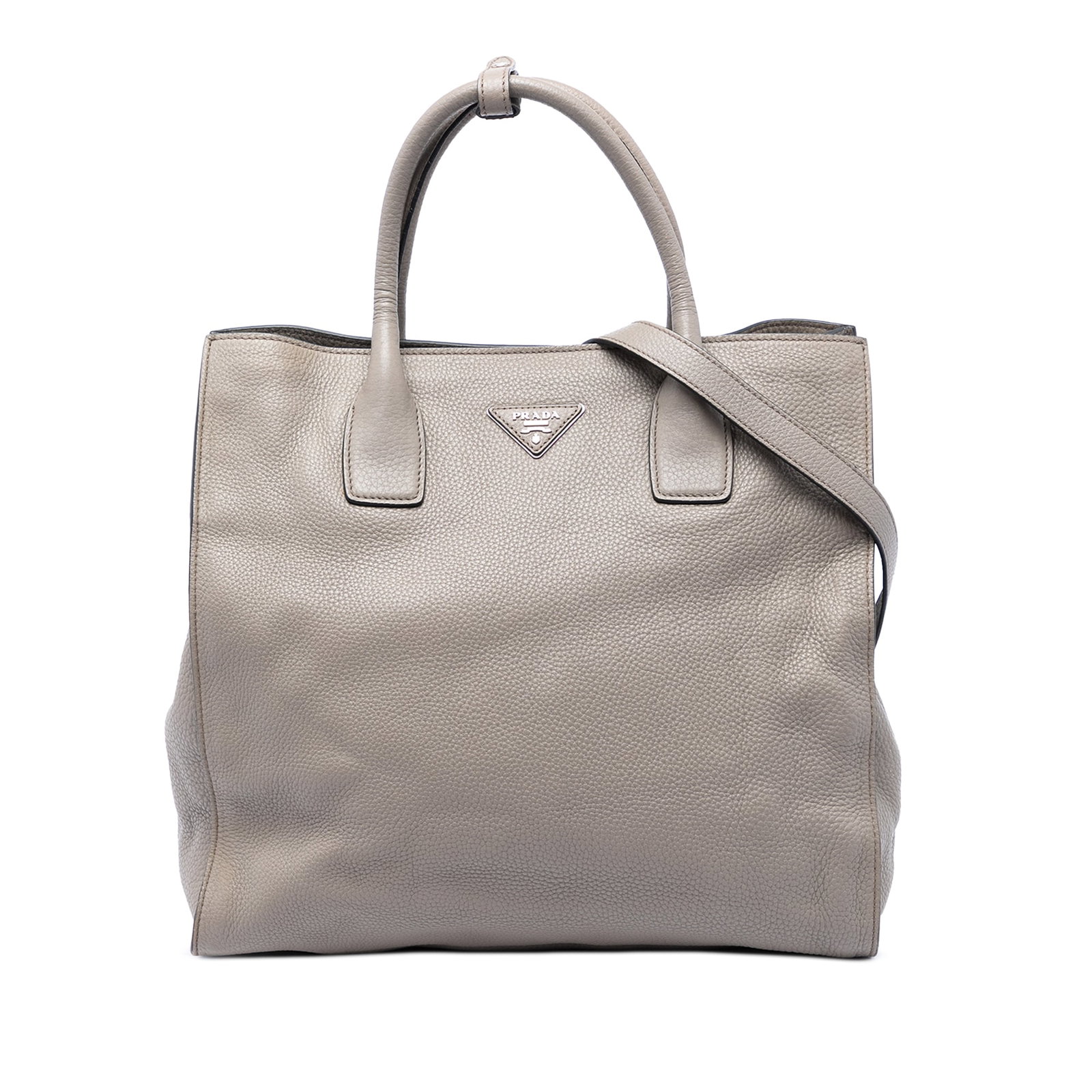 Prada Vitello Daino gray leather convertible tote bag: Prada Vitello Daino gray leather convertible tote bag This Prada Vitello Daino Open Convertible Tote is a gray leather satchel made in Italy. It features rolled leather top handles, a detachable and a