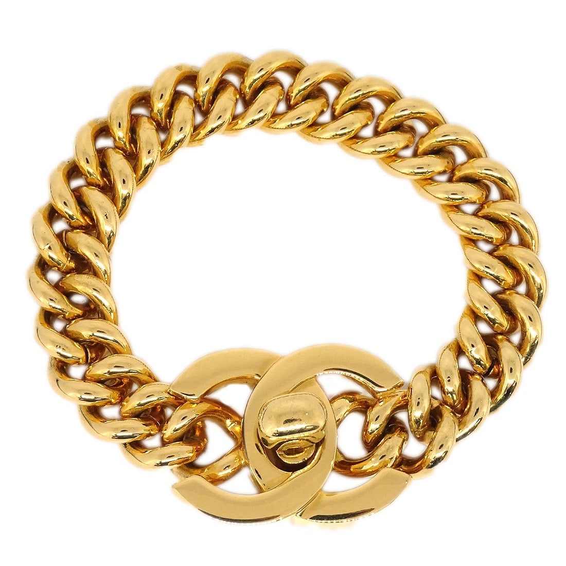 CHANEL 95A Turnlock Gold Plated Bracelet France: CHANEL 95A Turnlock Gold Plated Bracelet France Chanel turnlock bracelet in gold-plated metal with a charm detail and box included. Marked 95A and made in France. Condition is very good, showing minor
