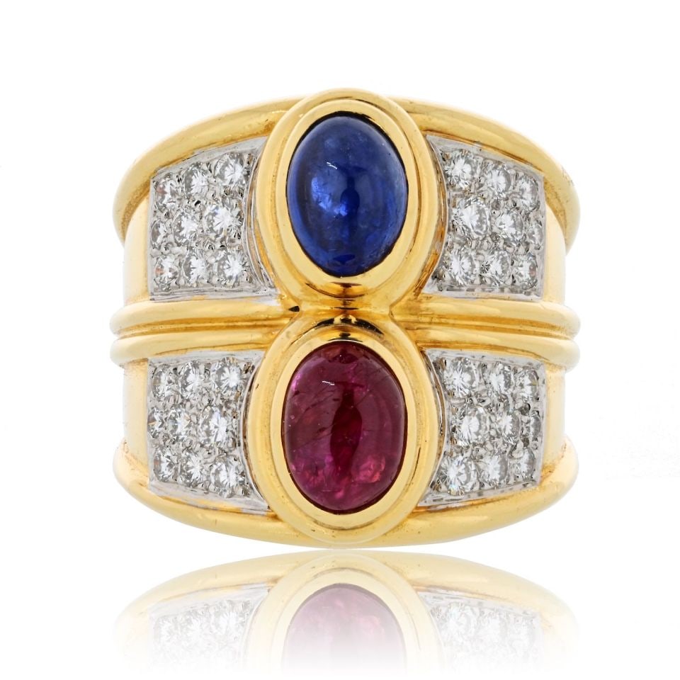 David Webb Estate Ring Platinum 18K Gold Diamond Sapphire Ruby: David Webb Estate Ring Platinum 18K Gold Diamond Sapphire Ruby A bold estate ring crafted in platinum and 18K yellow gold, featuring an oval cabochon sapphire and an oval cabochon ruby at the center, 